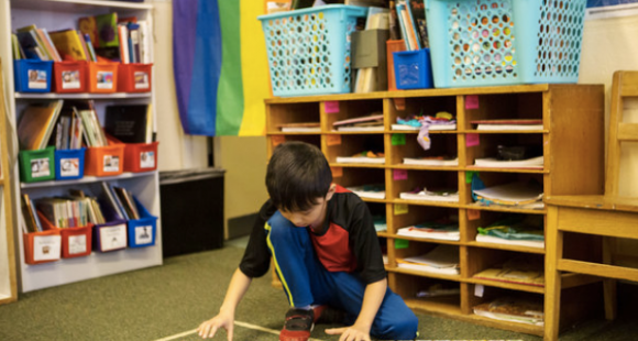 NYTimes image of child playing with digitally enhanced sequencing blocks